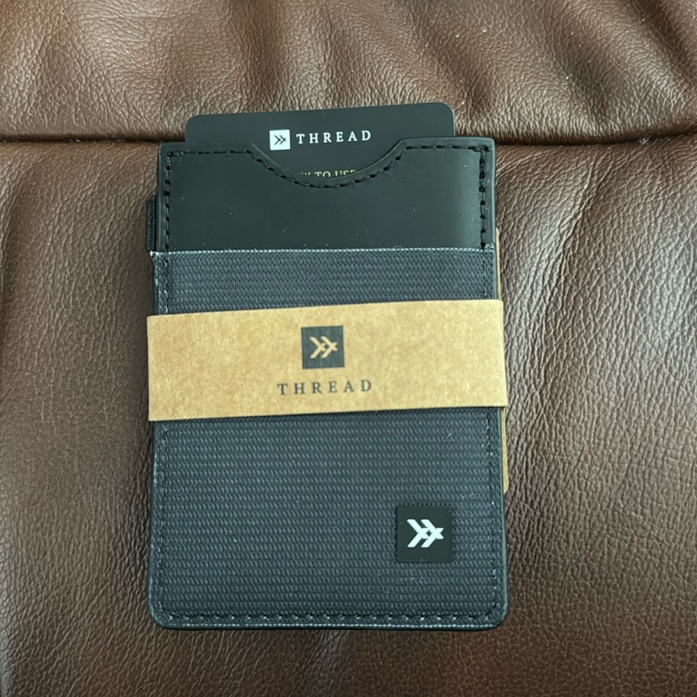 Black thread vertical wallet. RFID blocking